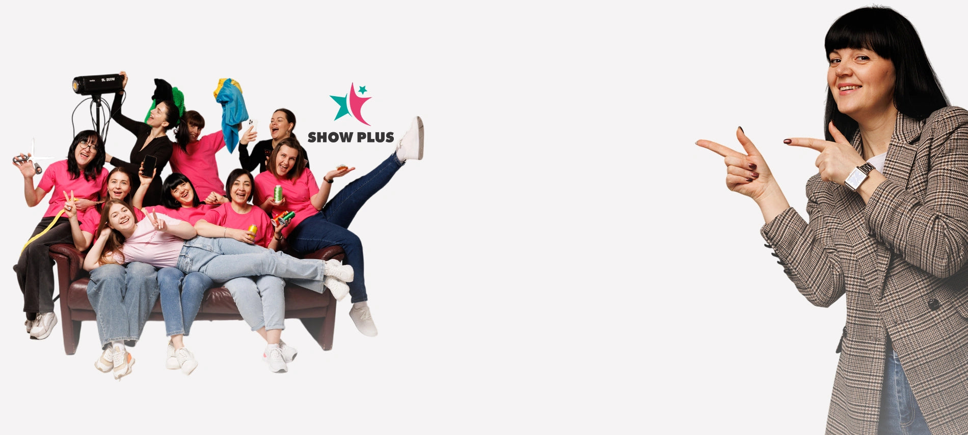 Group of people posing together with a person in a suit making a peace sign, against a white background with Show Plus logo.